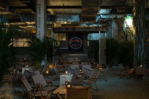 A large dining table surrounded by multiple chairs in a restaurant or cafeteria setting, creating an inviting and comfortable atmosphere with ample seating options