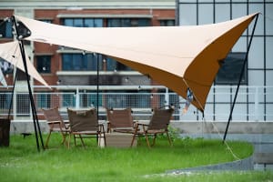 An inviting outdoor patio with a mix of chairs and a dining table, perfect for socializing and enjoying meals in a comfortable setting
