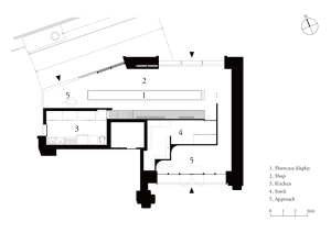 Black and white floor plan of a hotel with various rooms and spaces, including a lobby and kitchen
