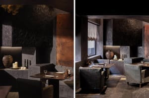 Dimly lit dining and lounge space with wine glasses, vases, and a couch near a window
