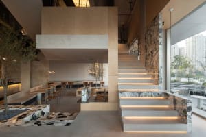 A modern staircase with wooden steps, clean lines, and natural light, inviting exploration of the building's interior