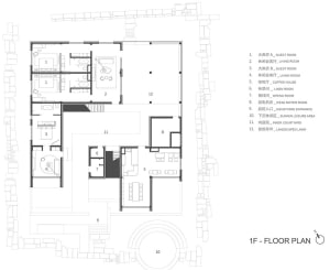 Classic hotel floor plan with multiple levels, labeled rooms, and stairs, possibly in black and white or sepia tone