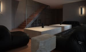 Cozy living room with a large couch, fireplace, chairs, dining table, TV, and staircase, creating a warm and inviting atmosphere