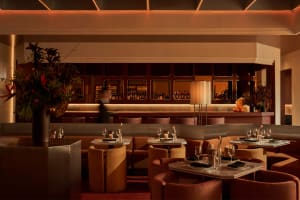 Sophisticated dining space with wooden furniture, wine glasses, and a comfortable atmosphere