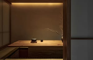 Warm and inviting living space with a wooden table, vases, and bowls, featuring cozy wooden elements