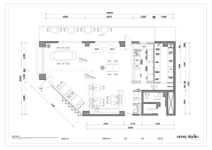 Detailed modern office space floor plan with a staircase, white walls, and clean lines