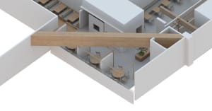 A modern dining space with multiple tables and chairs, natural light from windows, and a clean and functional atmosphere