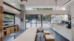 Inviting open space with seating options, a dining table, and ample room for guests to relax and socialize