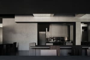 Modern kitchen with a wooden countertop, black walls, and silver appliances, featuring a sleek and contemporary atmosphere