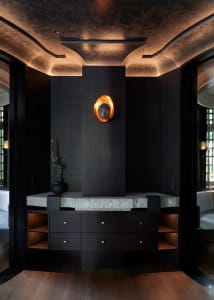 Modern living room with a wooden cabinet, two chairs, and a vase, featuring a sophisticated ambiance