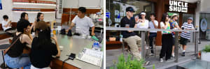 A casual restaurant scene with a counter and bar area, featuring cups, bottles, and a man sitting at the bar with a cell phone