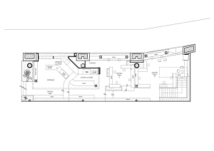 2D floor plan of a modern coffee shop with various rooms and functional details