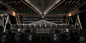 Elegant wine bar with wooden accents, wine bottles, and comfortable seating