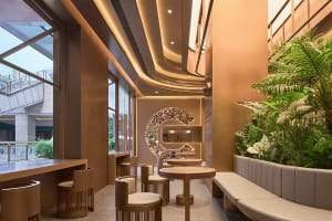 Warm and inviting cafe interior with wooden tables and chairs, ample seating for guests