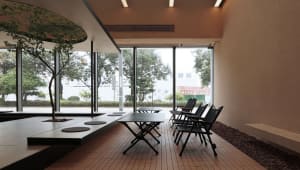 Dining space with a wooden table and black-framed chairs in a cozy atmosphere