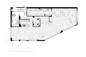 2D floor plan of a modern hotel with clean lines, minimalistic elements, and large windows allowing natural light