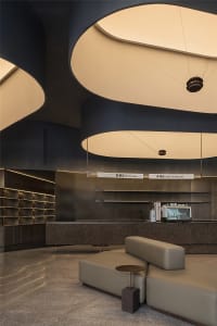 Inviting restaurant interior with a counter, dining table, chairs, and a coffee machine, creating a comfortable atmosphere for dining