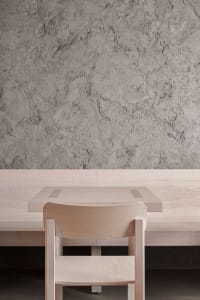 A warm and inviting dining space with a wooden table and chairs, perfect for socializing and enjoying meals together
