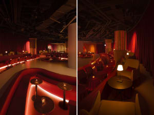 A warm and inviting restaurant interior with red walls, multiple chairs, and dining tables, perfect for a meal