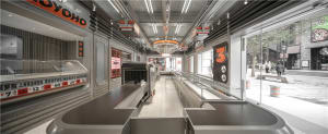 A large open lobby with tables, chairs, and benches, creating a spacious and inviting atmosphere
