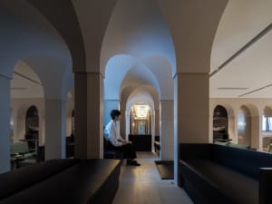 Comfortable lobby area with benches and chairs, inviting atmosphere, and natural lighting