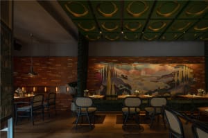 Modern restaurant interior with wooden floors and walls, multiple dining tables, and comfortable seating