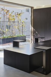 A cozy dining space with a metal table and chairs, surrounded by inviting atmosphere and comfortable seating
