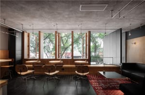 Warm and inviting open concept living area with a dining table, red tablecloth, wood elements, and natural light from windows