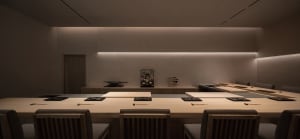 Empty restaurant dining area with wooden tables and chairs, clean and well-organized, ready for customers