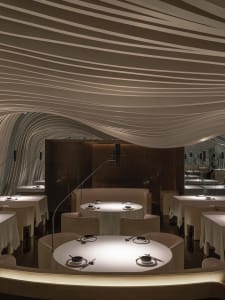 Elegant dining space with modern seating, tables, and contemporary design elements