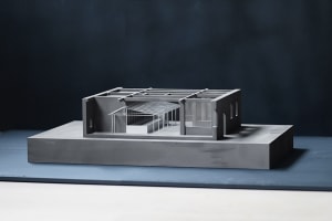 Grayscale architectural model of a house with intricate design elements and composition