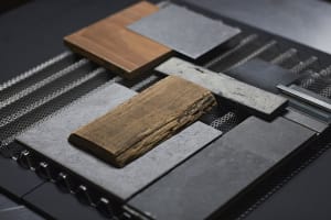 Artistic arrangement of wood, stone, and metal on a table, showcasing unique textures and colors