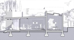 A modern cafe with a large open area featuring chairs and dining tables, designed for socializing and enjoying meals together