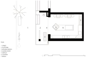 Architectural drawing of a modern building interior with multiple rooms, including a dining area and living space, with linework and labels