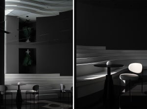 Modern dining and bar space with multiple seating options, a dining table, and a bar area with stools, featuring a mix of functional and decorative elements