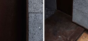 Grey stone and concrete building with industrial design, showcasing contrasting materials and modern aesthetic