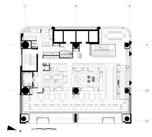 White and black floor plan of a modern office space with concrete floors and walls, featuring multiple rooms and hallways