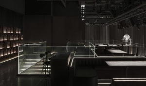Dark and intimate dining space with modern design, clean lines, and minimalistic decorations