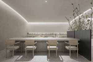Empty modern restaurant interior with a long wooden dining table and chairs, clean and quiet ambiance