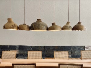 A warm and inviting dining area with a wooden table and chairs, perfect for socializing and enjoying meals together