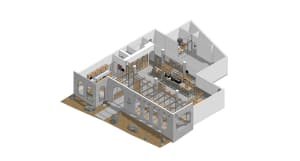 Thoughtfully designed interior with a mix of open areas and enclosed rooms, featuring concrete walls, natural light, and modern furniture