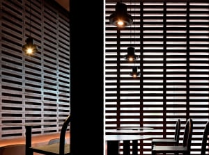 Dining area with a wooden table surrounded by metal chairs in a cozy and inviting space