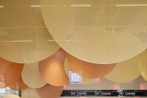 Inviting modern cafe with round shapes, textures, clocks, and dining tables, creating a unique and stylish environment