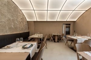 Empty restaurant with wooden tables and chairs, inviting atmosphere, comfortable dining experience