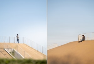 A modern metal staircase with a ramp, set in a calm and peaceful environment with no signs of activity