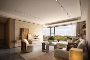 Cozy modern living area with a white couch, chairs, potted plants, and a dining table, featuring a clean and minimalistic design