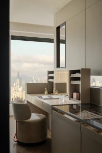Architectural rendering of a high-rise living room with a large window offering a city view, featuring two chairs and a dining table with a book