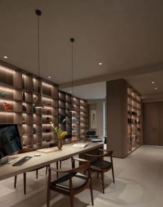 Cozy modern living space with a large bookshelf, chairs, a dining table, and a TV, featuring a comfortable and inviting atmosphere