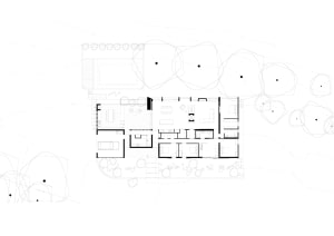A well-designed interior space with a white house, multiple rooms, chairs, and dining tables, showcasing a comfortable and functional layout