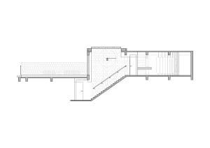 Simple floor plan of a stairwell and hallway with a staircase and door, featuring a top-down layout with linework and labels